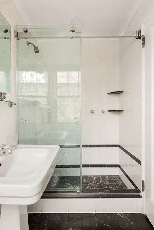 bathroom with glass doors to shower