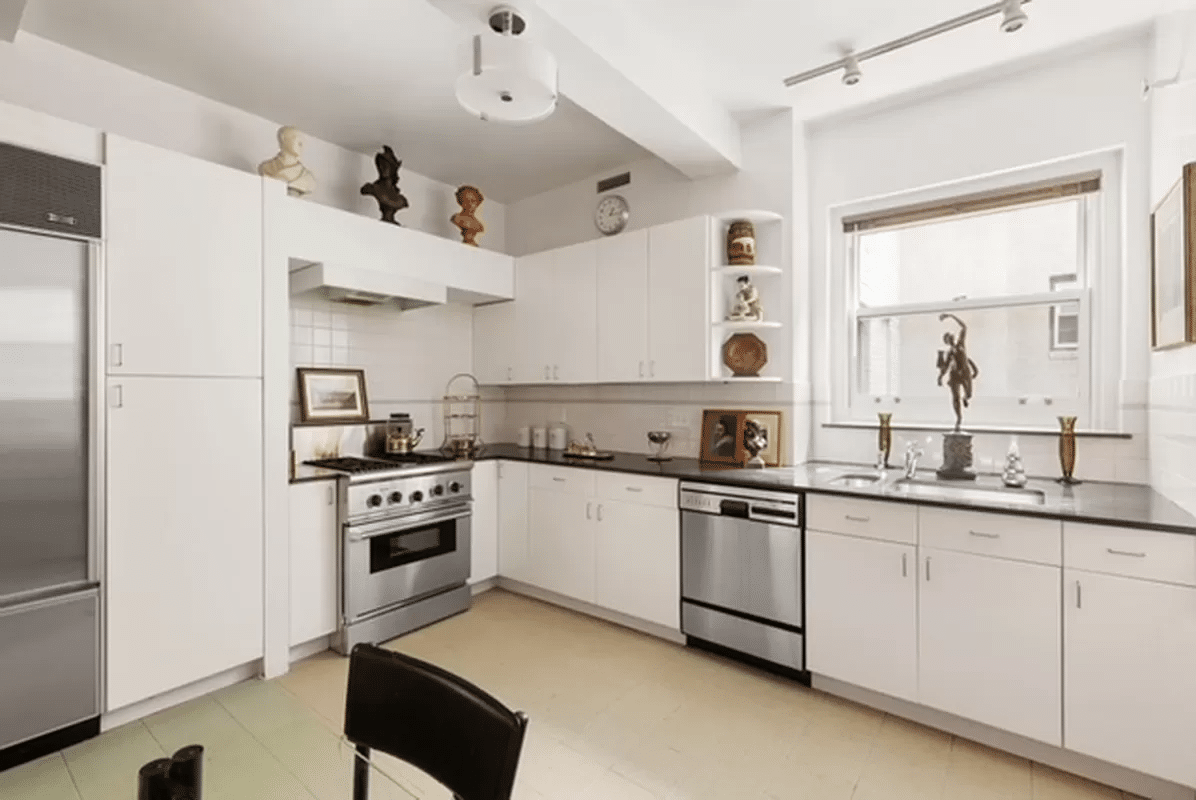 kitchen with white cabinets and a dark counter tops