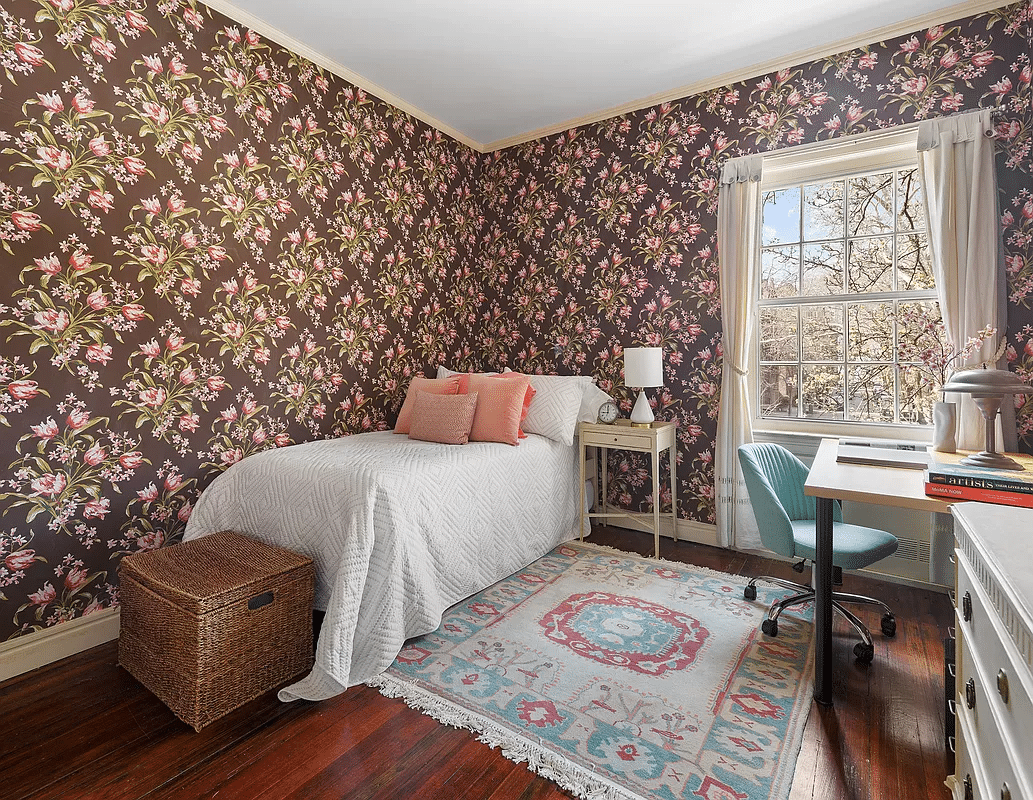 bedroom with chocolate brown and pink floral wallpaper