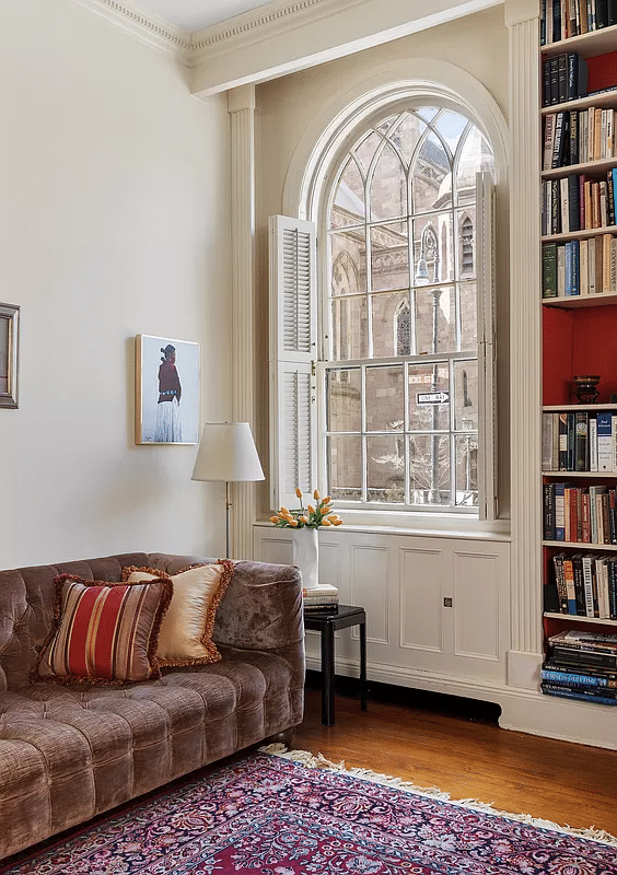 corner of the living room with arched window and view out to hicks street