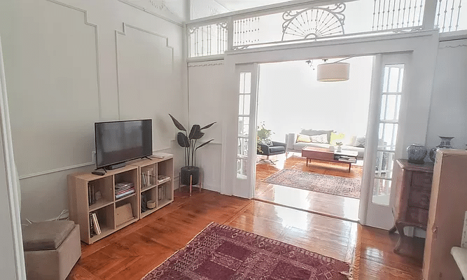 middle parlor with wall moldings, fretwork screen