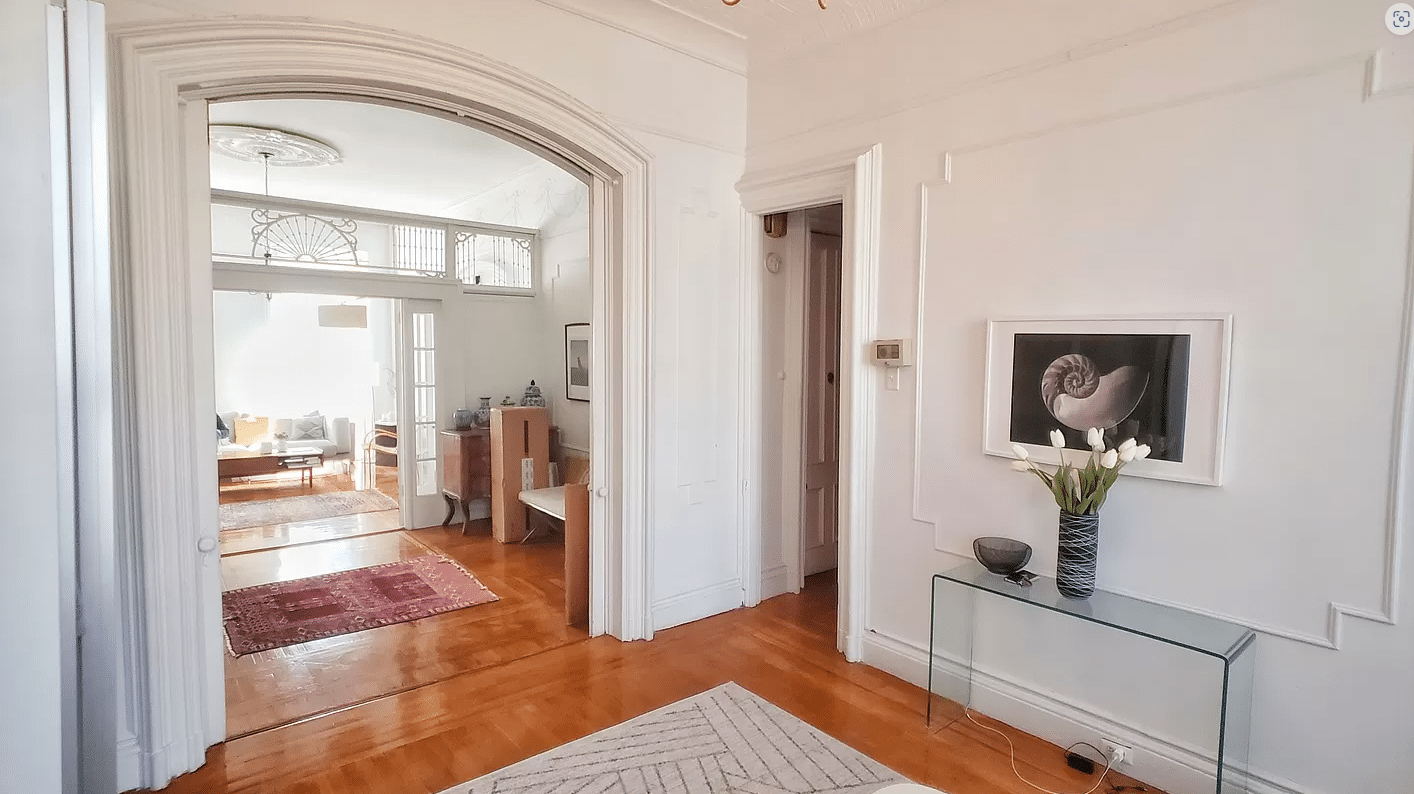 cobble hill - room with wall moldings, wood floor