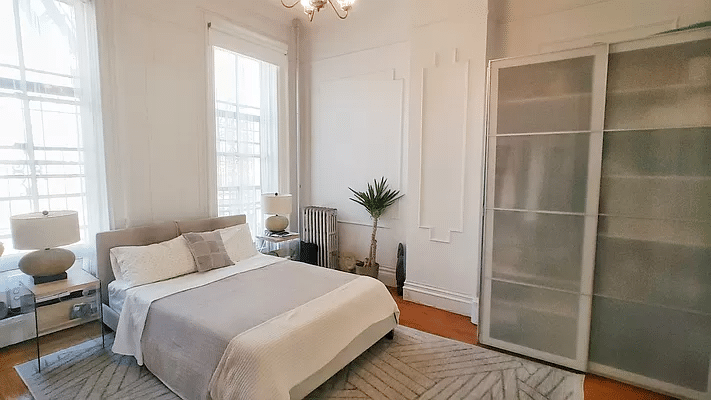 bedroom with wall moldings