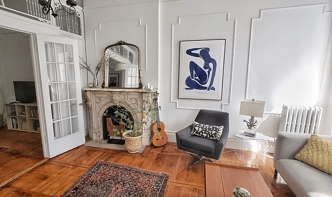 cobble hill - living room with wall moldings, wood floor, french doors