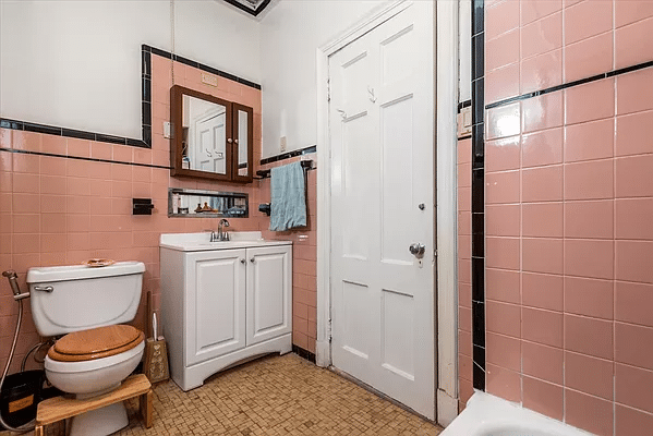 bathroom with pink wall tiles