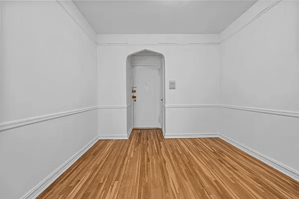 foyer with picture rail, chair rail and wood floor