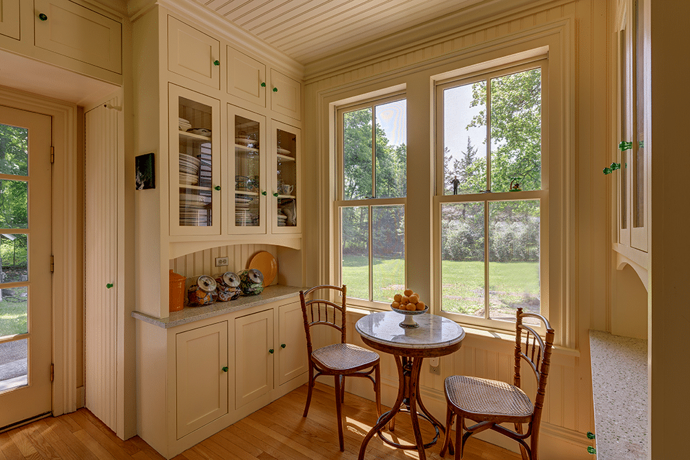 kitchen with straw yellow cabinets and a breakfast nook