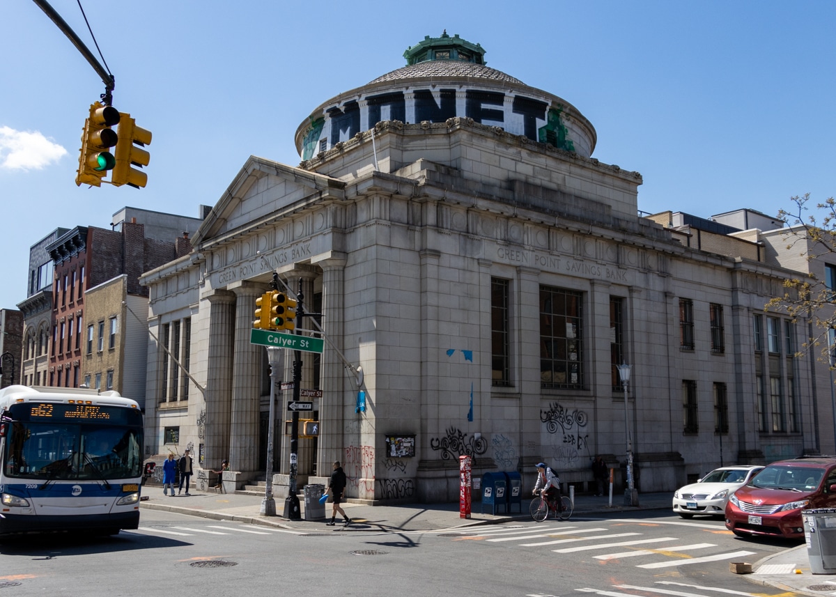 brooklyn - a B62 bus drives by the greenpoint savings bank