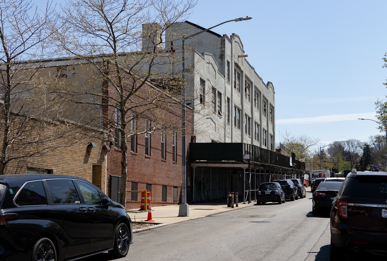 view along 25th street showing construction shed in front of former laundry