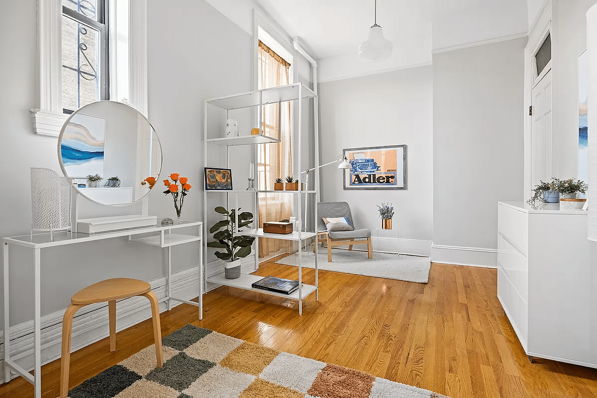 bedroom with wood floor and picture rails