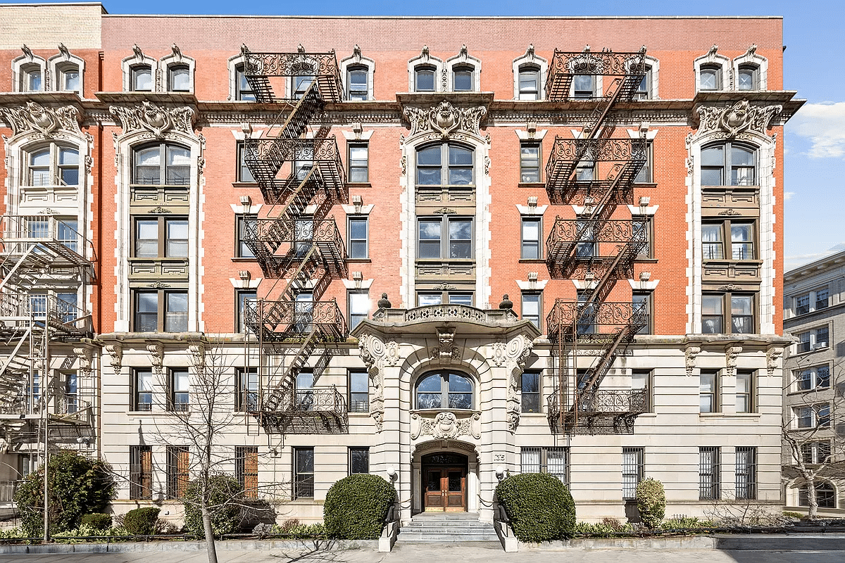 red brick and limestone beaux arts style apartment building