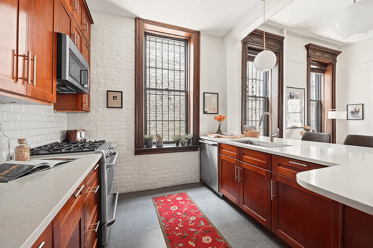 kitchen with wood cabinets and white tile backsplash