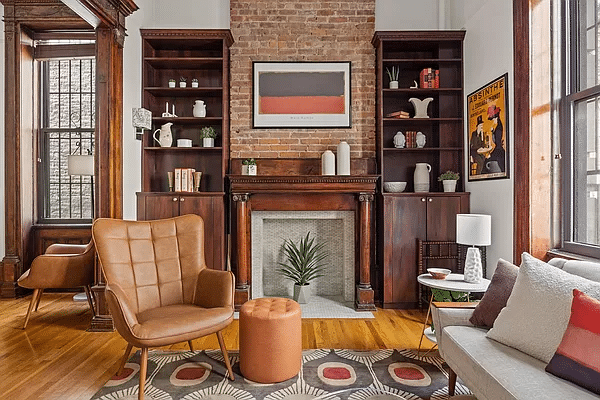 park slope - living room with wooden mantel and exposed brick