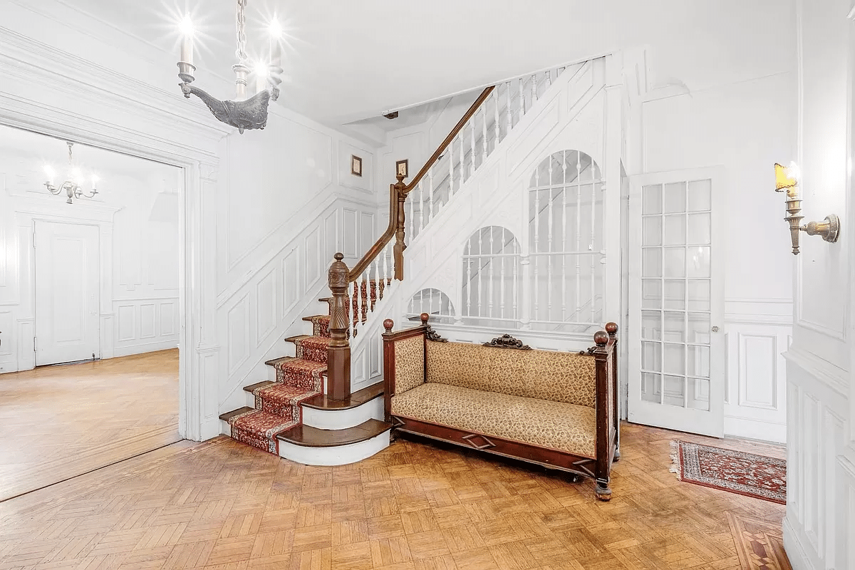 middle parlor with original stair, wainscoting