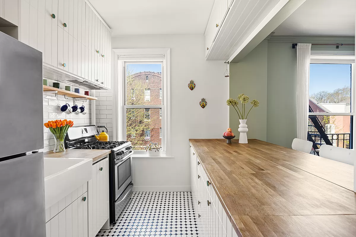 sunset park kitchen with beadboard cabinets and apron sink