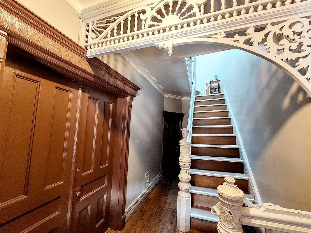 entry to house with original stair and fretwork