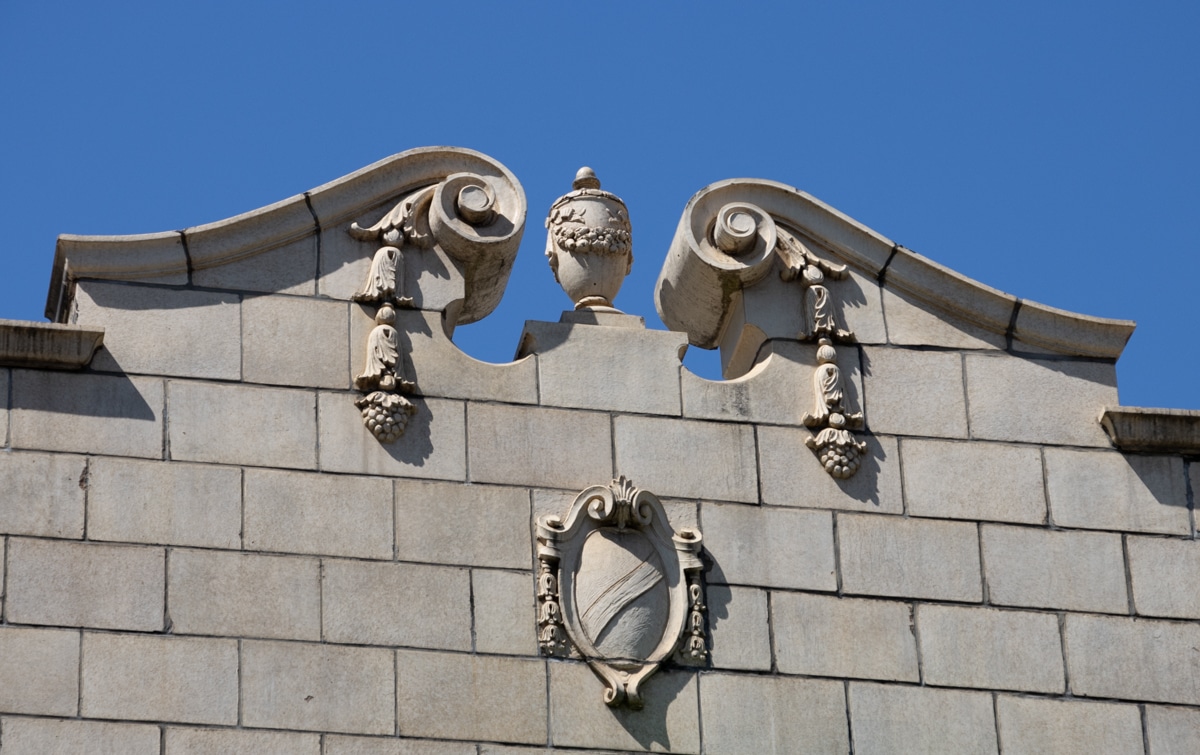 an urn and a shield ornament the pediment