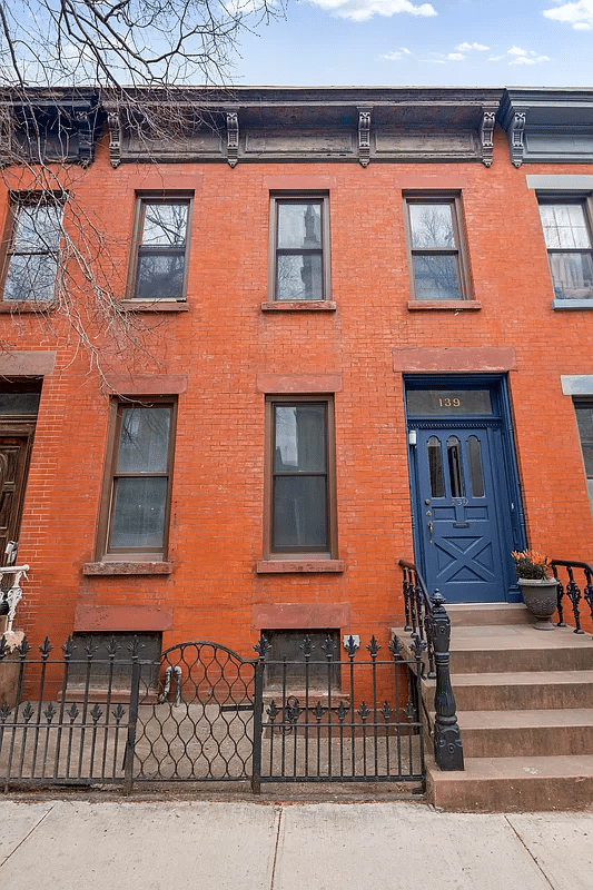red brick exterior of the row house