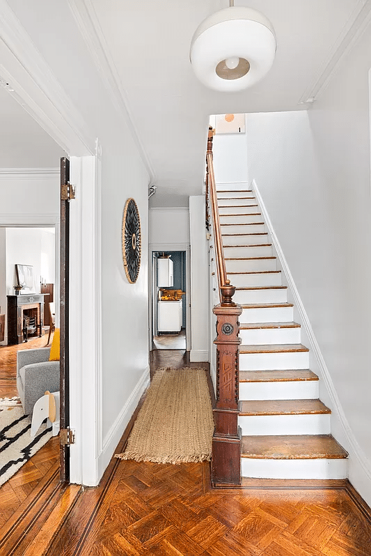 entry with wood carved banister