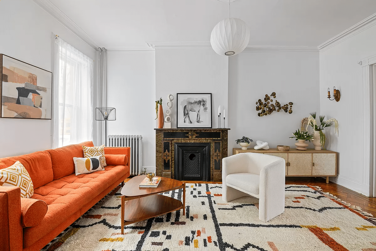 windsor terrace - living room with white walls, wood floors and a mantel