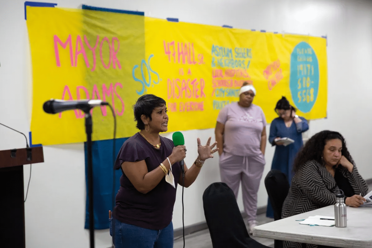 shelter - Suman Raghunathan speaks at a community meeting
