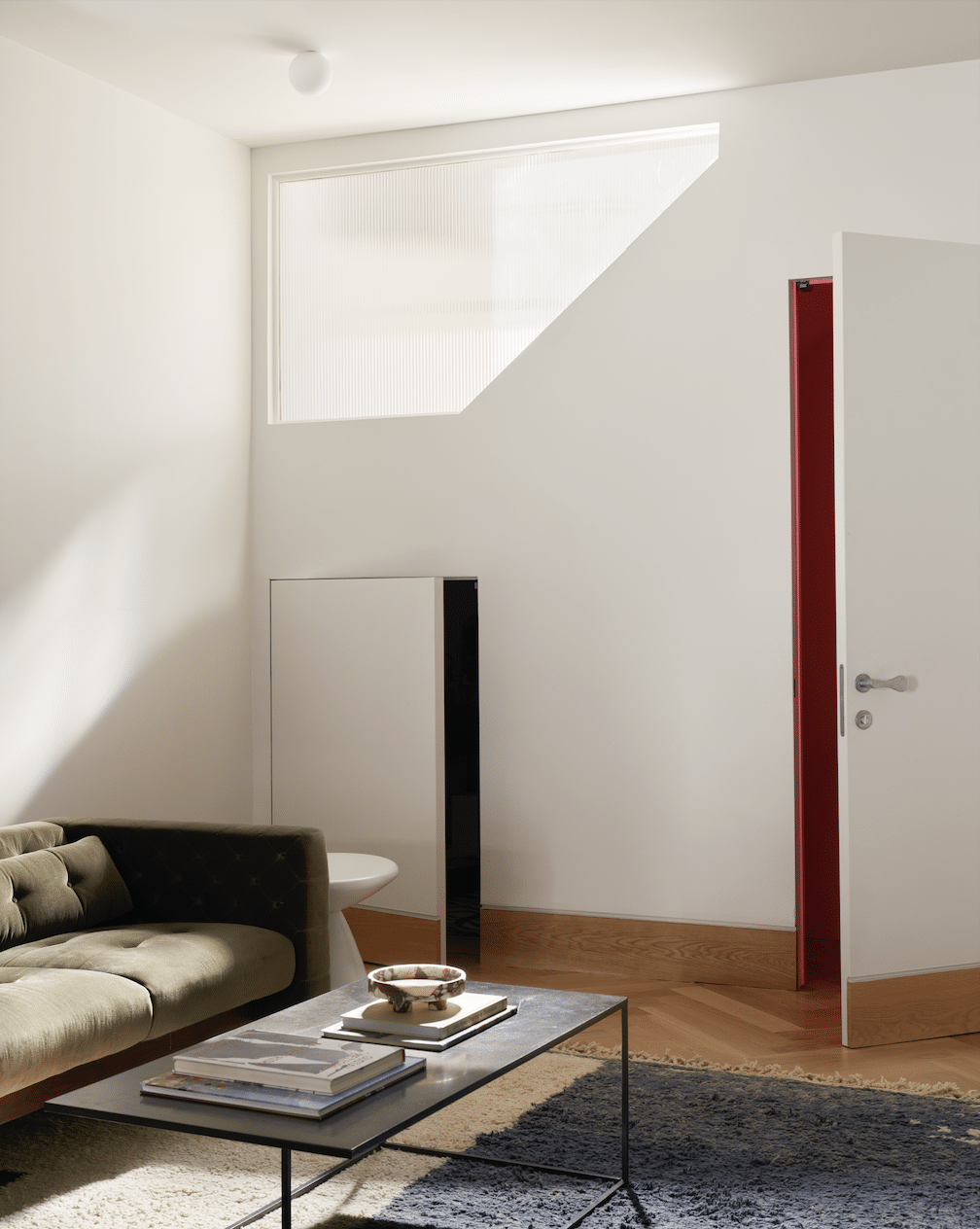 LIVING ROOM WALL WITH ANGLED WINDOW