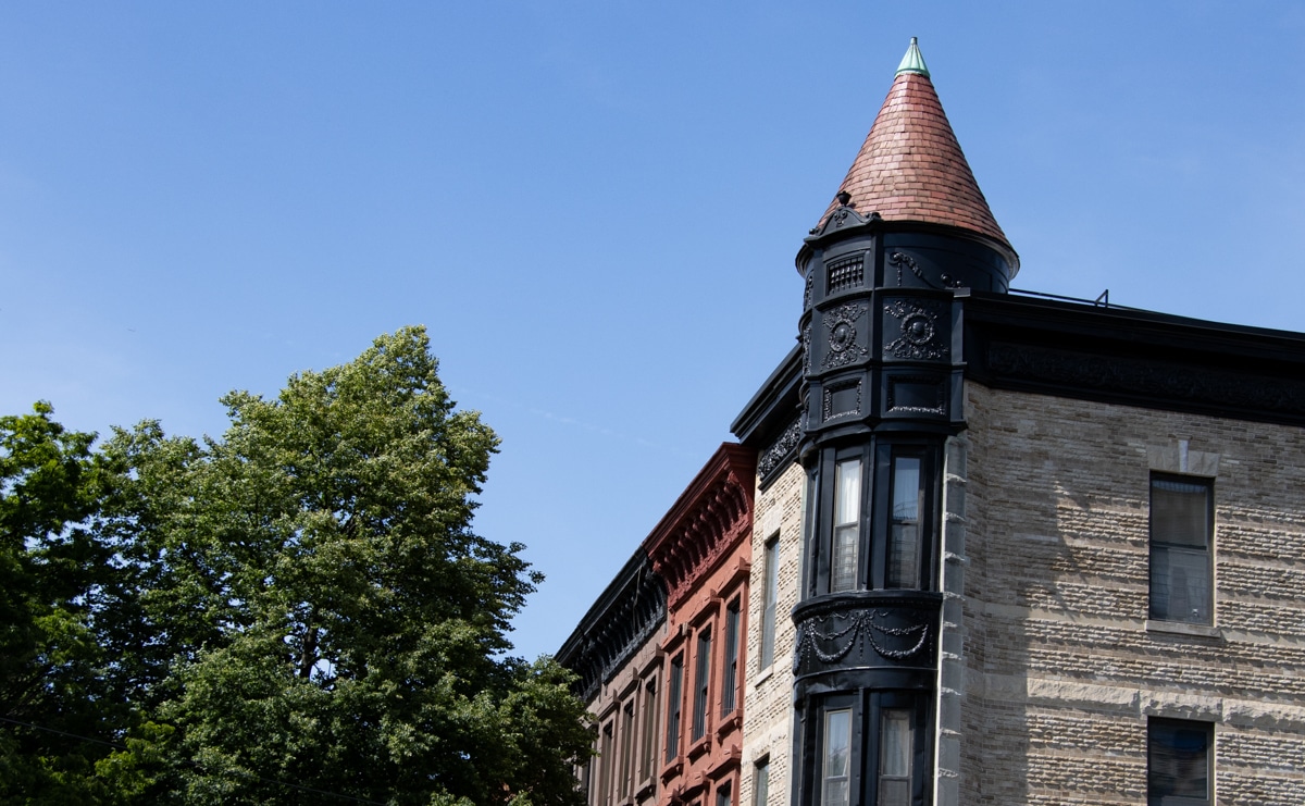 Brooklyn - building with a corner tower next to a row of brownstones