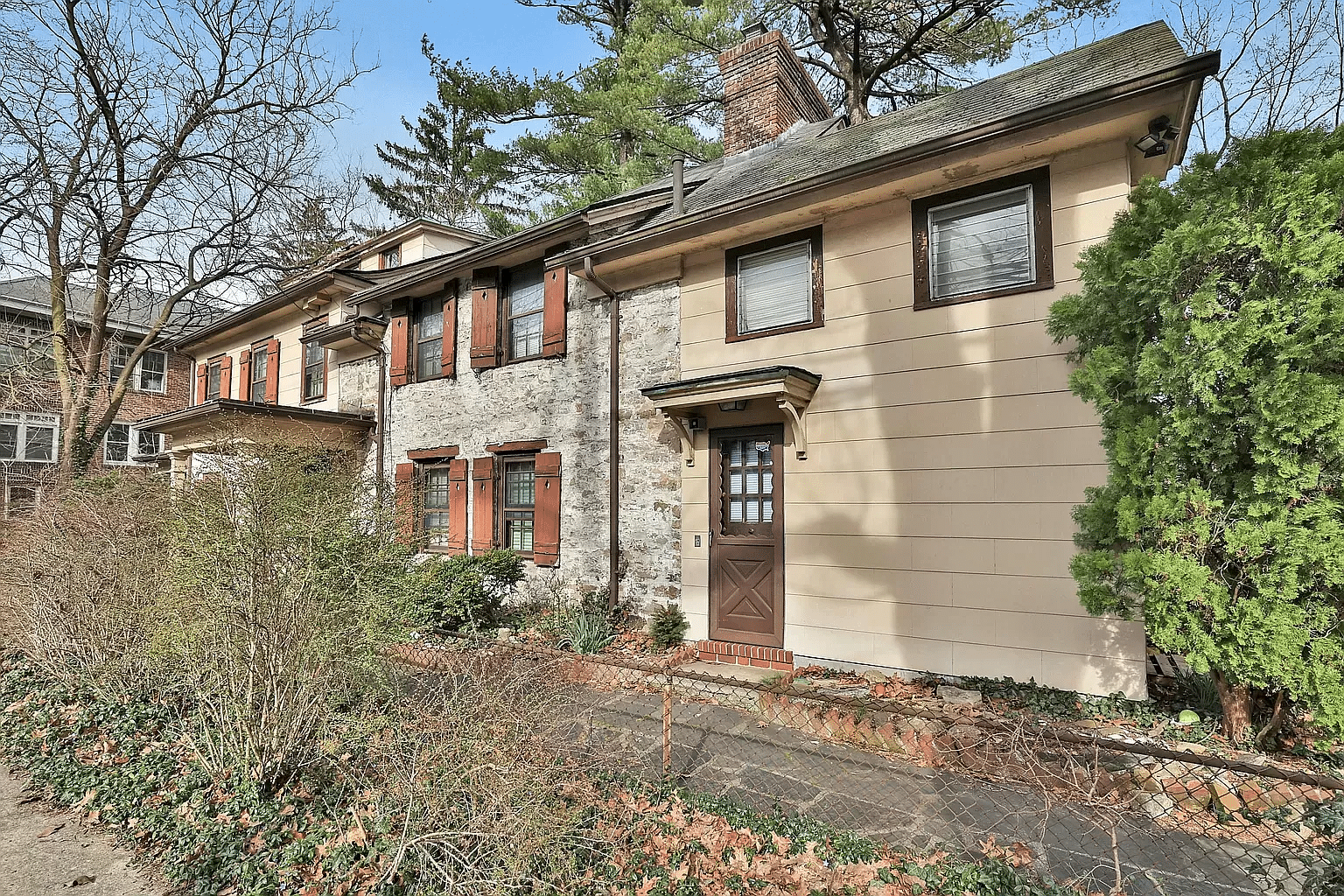 house with frame and stone sections