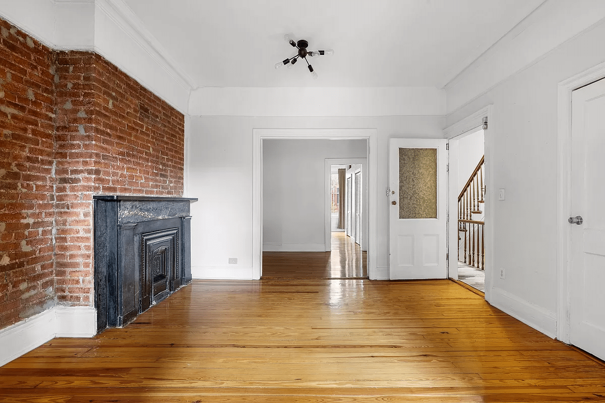 brooklyn - room with white walls, mantel and exposed brick