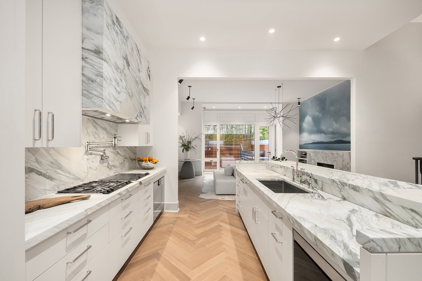 kitchen with marble counters and white cabinets