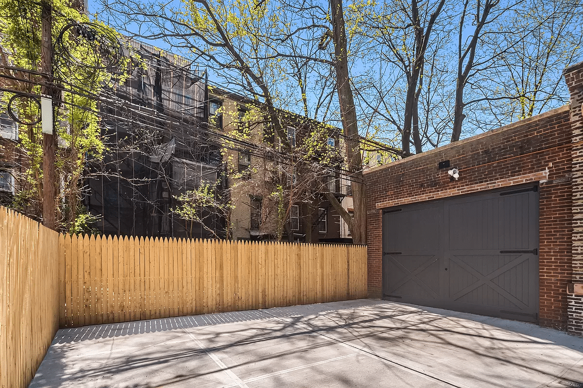 brick garage with driveway