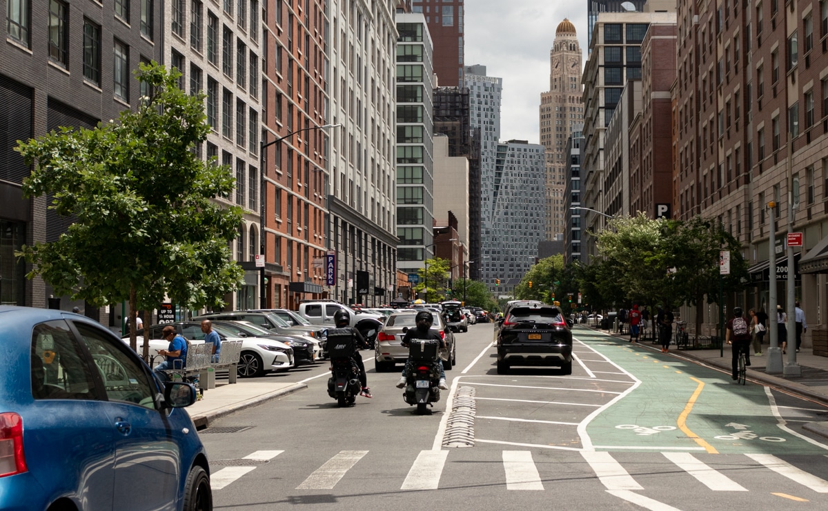 brooklyn - traffic on a brooklyn street with the williamsburg savings bank tower in the background
