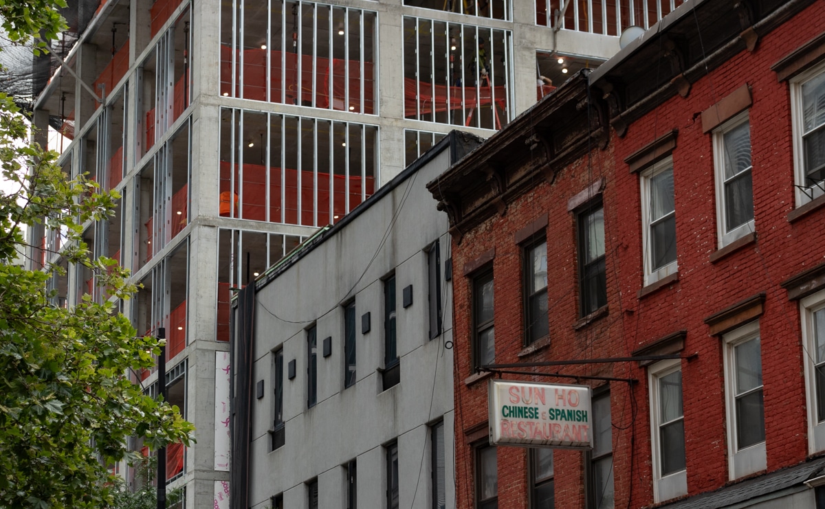 brooklyn - old and new buildings in brooklyn with a sign for a chinese and spanish restaurant
