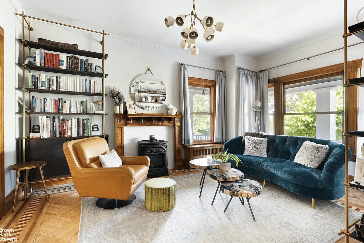 parlor with wood floor, mantel