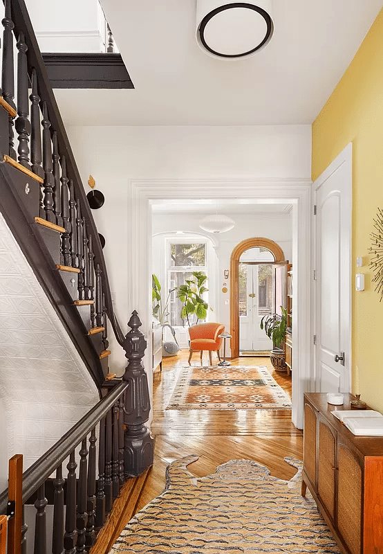hall with stair and view into front parlor