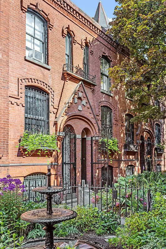 brick exterior of the narrow mews house