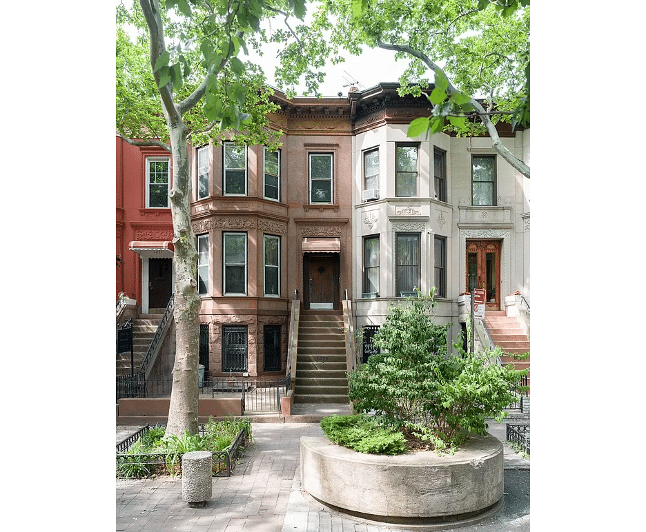 brownstone row house exterior with stoop