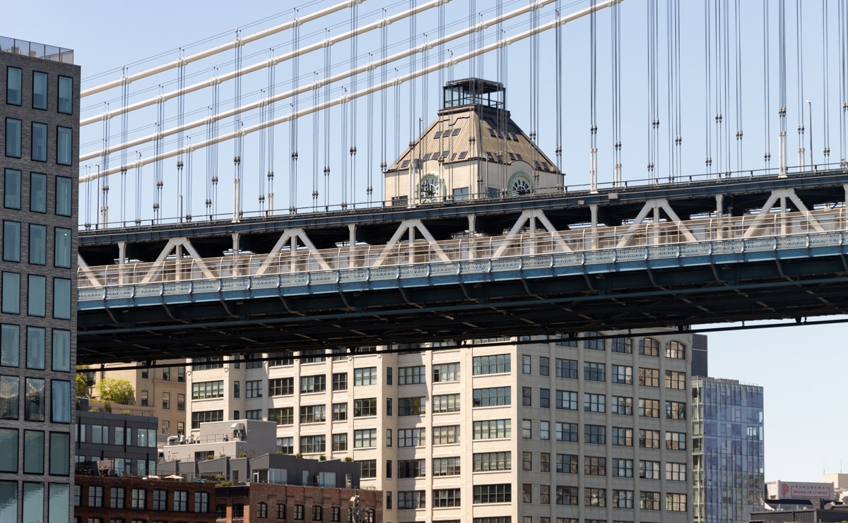 Brooklyn - the Manhattan Bridge in front of a clocktower in Dumbo