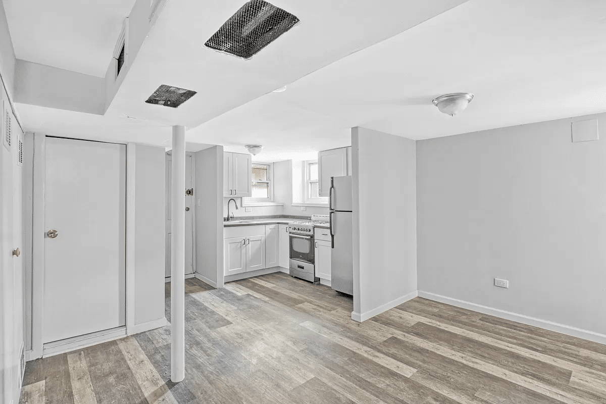 basement with vinyl flooring, kitchen