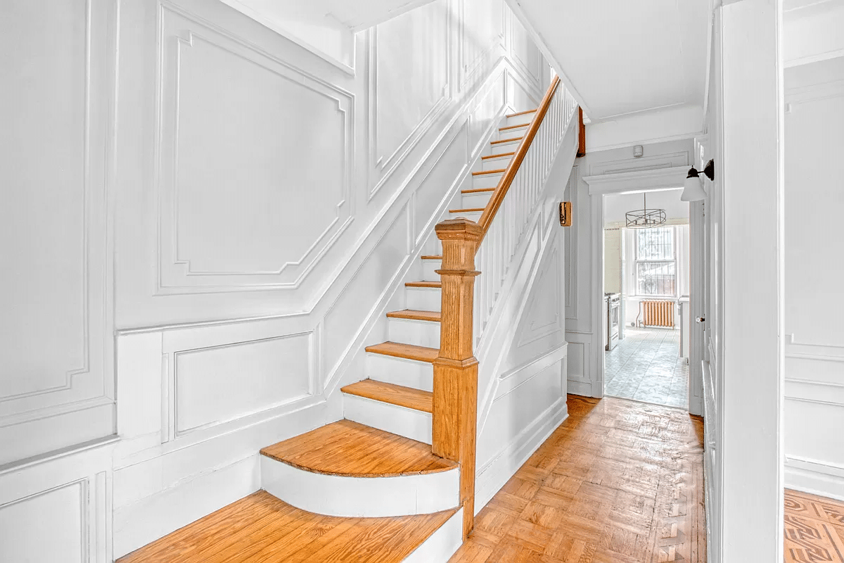 entry with original stair, wall moldings