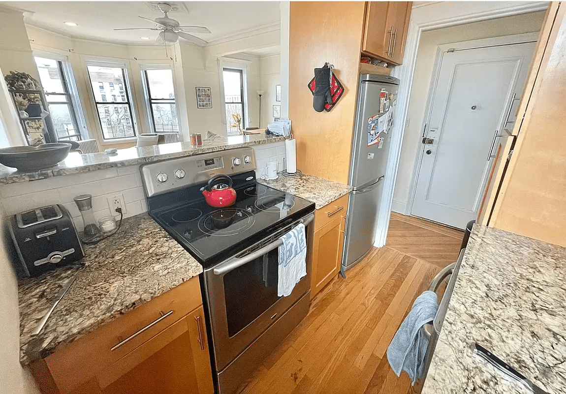 galley kitchen with wood cabinets
