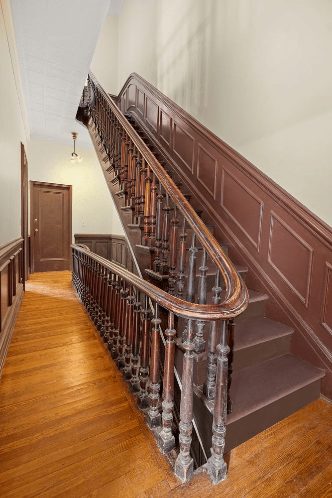 stair with curved rail, wainscoting