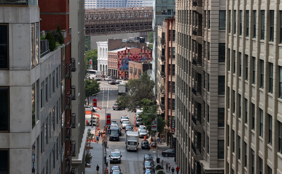 Brooklyn: view of old and new buildings in Dumbo, viewed from the Manhattan Bridge walkway