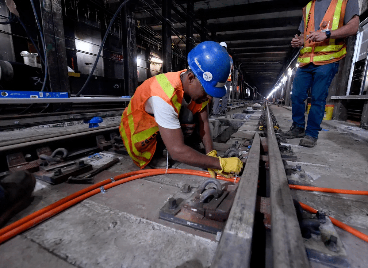 subway - workers underground working on subway tracks