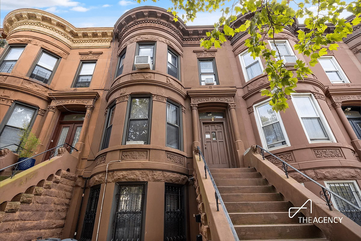 brownstone row house with stoop