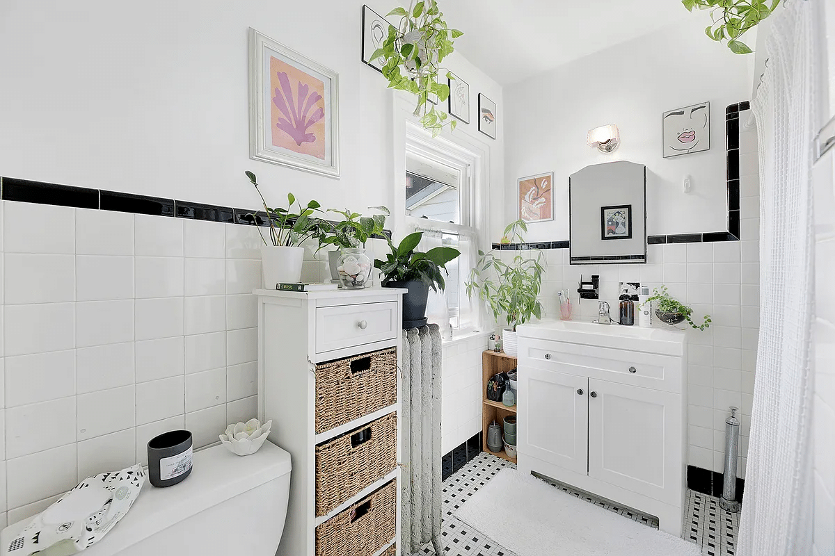 upstairs bedroom with white tile walls with block border and white fixtures