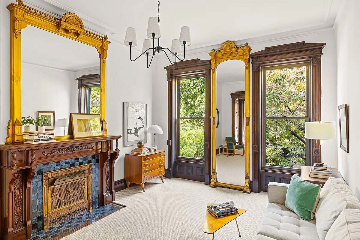 bedroom with mantel and pier mirror set up as a sitting room