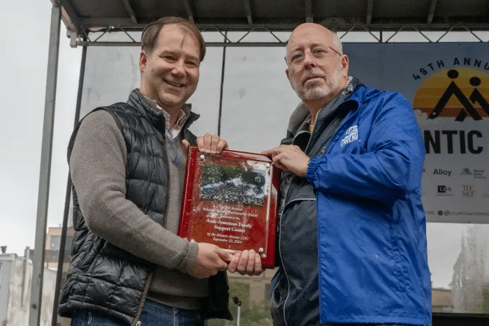 Howard Kolins presents Mark Foggin with the 12th annual Atlantic Avenue Ambassador Award.