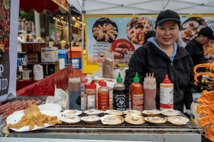 Vendor with fried octopus and oysters.