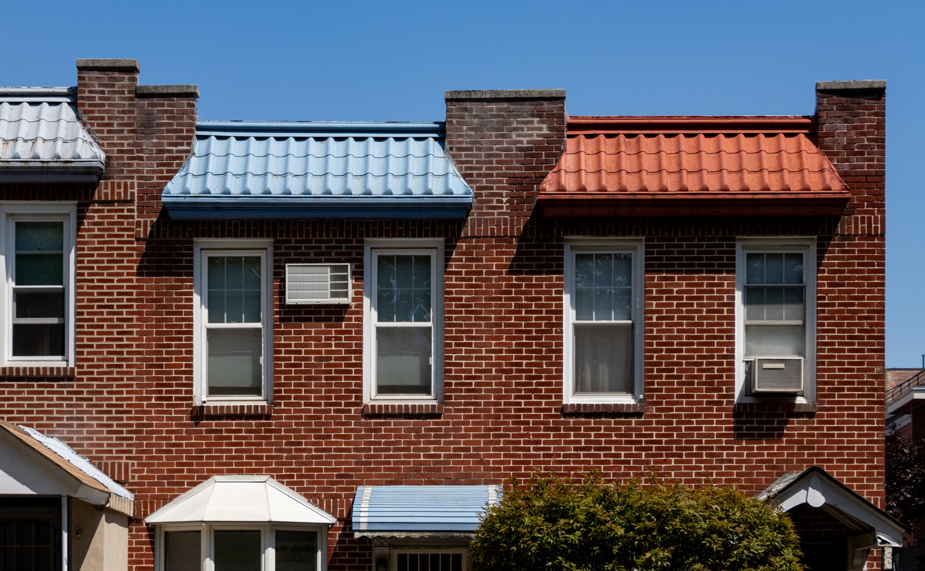 brooklyn - brightly colored tile roofs on brick houses in bay ridge